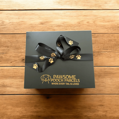 Pawsome Pooch Parcels dog gift box with black paw print ribbon on wooden table