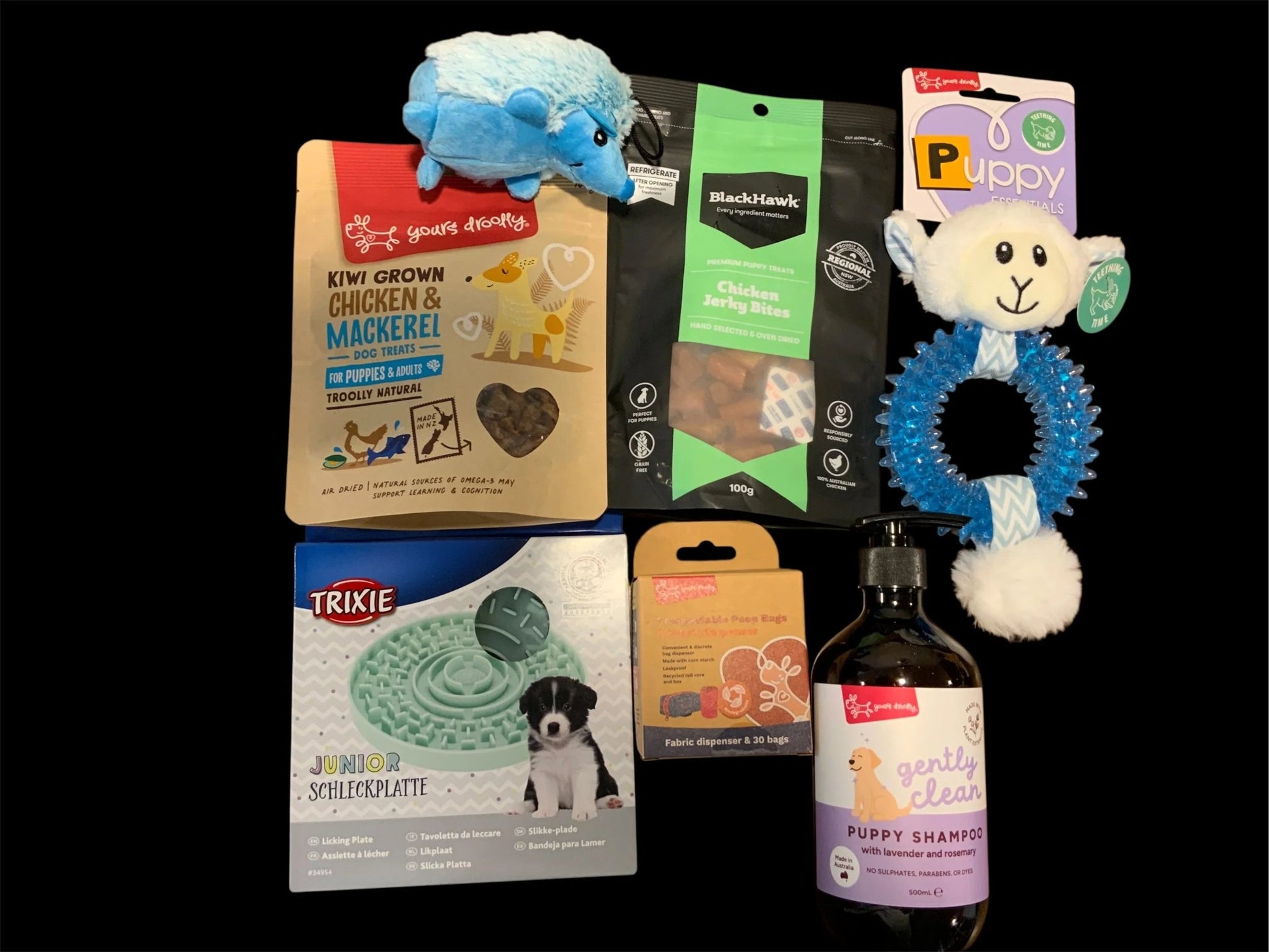 Pawsome Pooch Parcels puppy gift box with dog treats, toys, lick mat, shampoo, and poop bags
