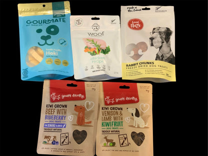 Assorted premium New Zealand dog treats in colorful packaging from Pawsome Pooch Parcels