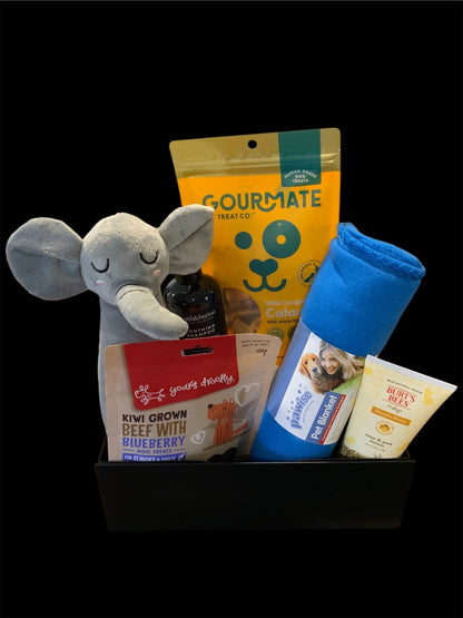 Premium dog gift box with treats, plush toy, pet blanket, shampoo, and balm from Pawsome Pooch Parcels