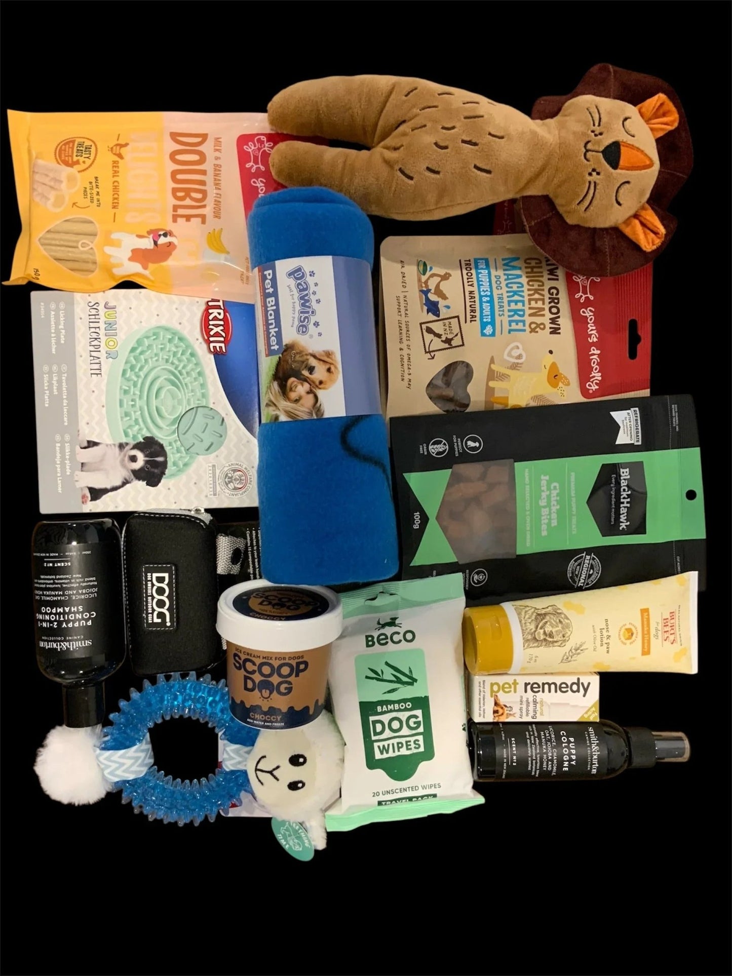 Premium dog gift box with treats, toys, blanket, dog wipes, and grooming products