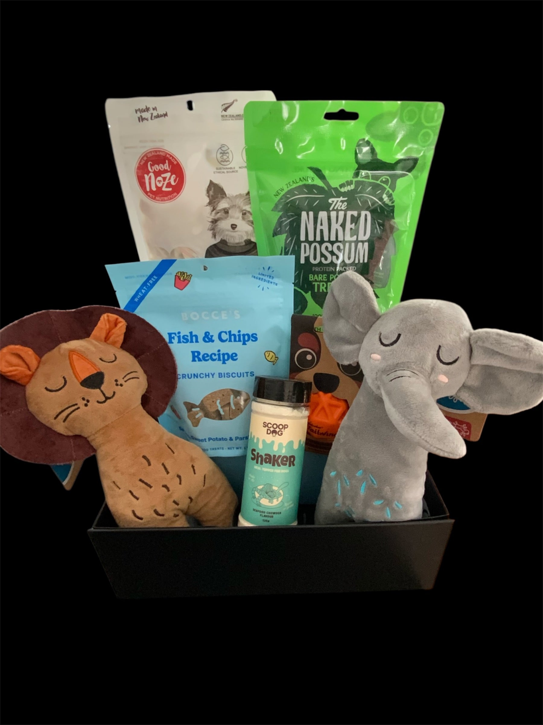 Pawsome Pooch Parcels dog gift box — NZ-made treats and plush lion and elephant toys