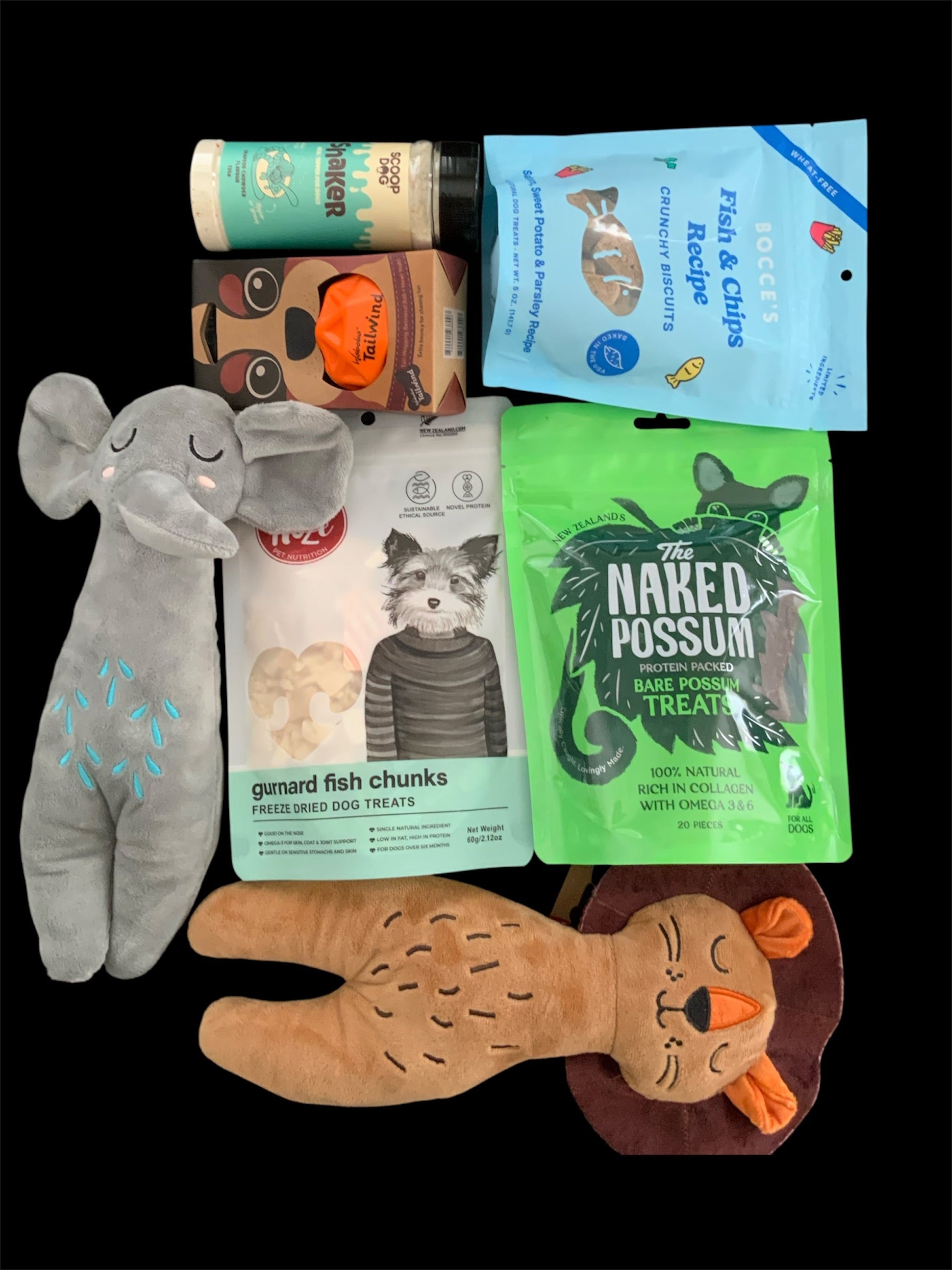 Pawsome Pooch Parcels dog gift box — NZ-made treats, fetch ball and plush lion and elephant toys